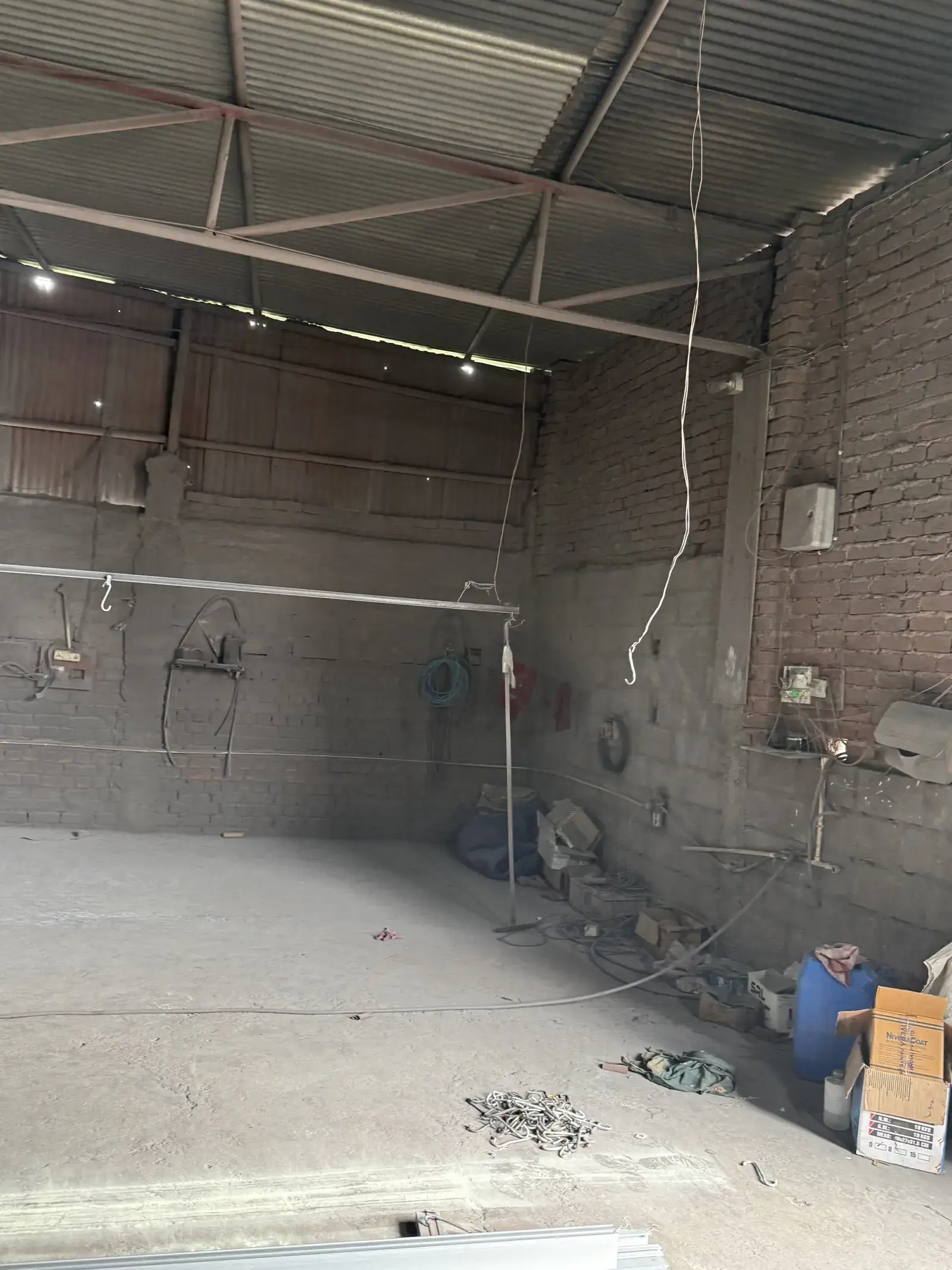 Interior of the industrial powder coating facility in Raipur with hanging racks