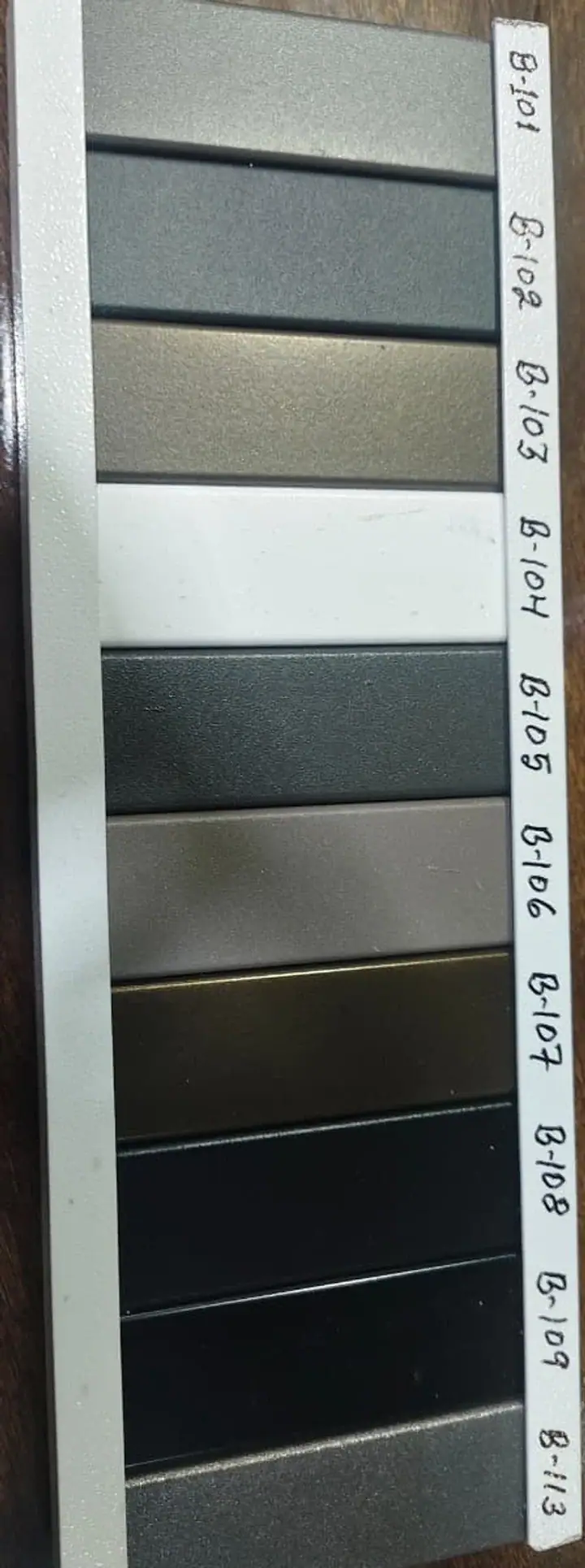 Powder coating colour sample board with labelled metal strips at Shree Balaji Coat in Raipur