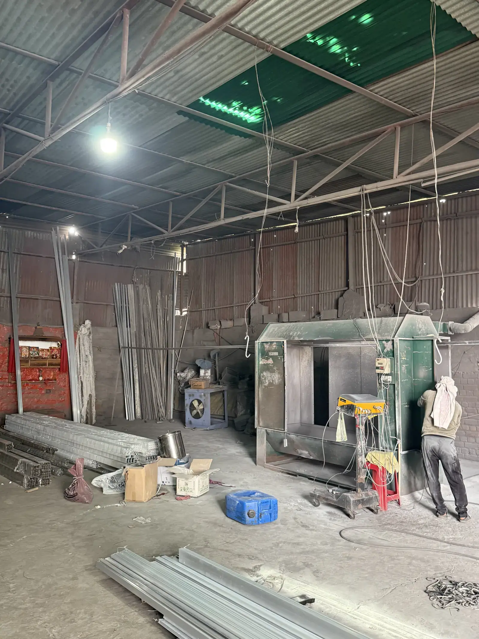 Powder coating spray booth and aluminium profiles inside the Raipur workshop